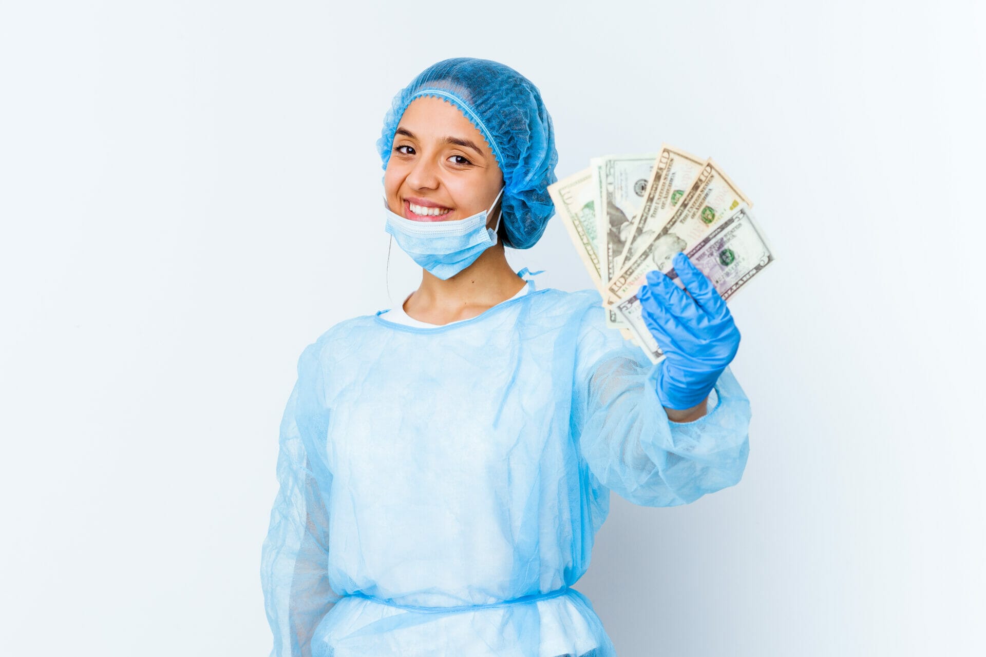 Unveiling the Earnings of Travel RNs in Canada 1 young mixed race doctor woman holding dollars isolated white background